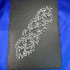 Silver-white crystal vine headband with symmetrical dangling rhinestones, a natural and ethereal hair accessory.